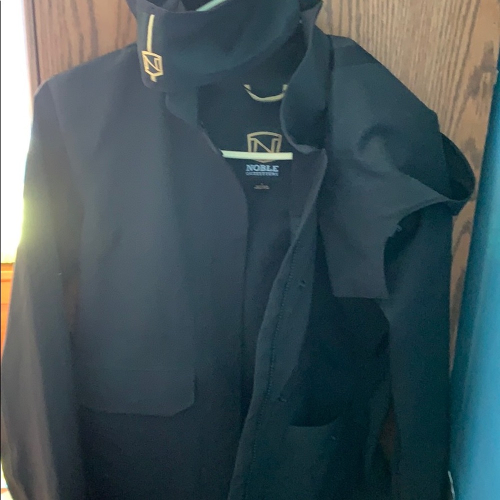 Noble pinnacle rain jacket and head band